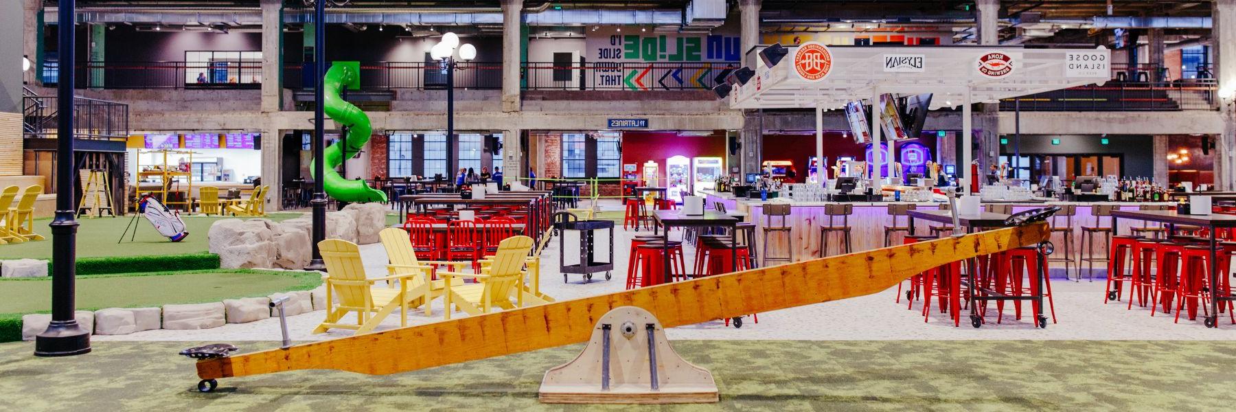 Armory STL, a new entertainment district, offers everything from adult seesaws to cold drinks.